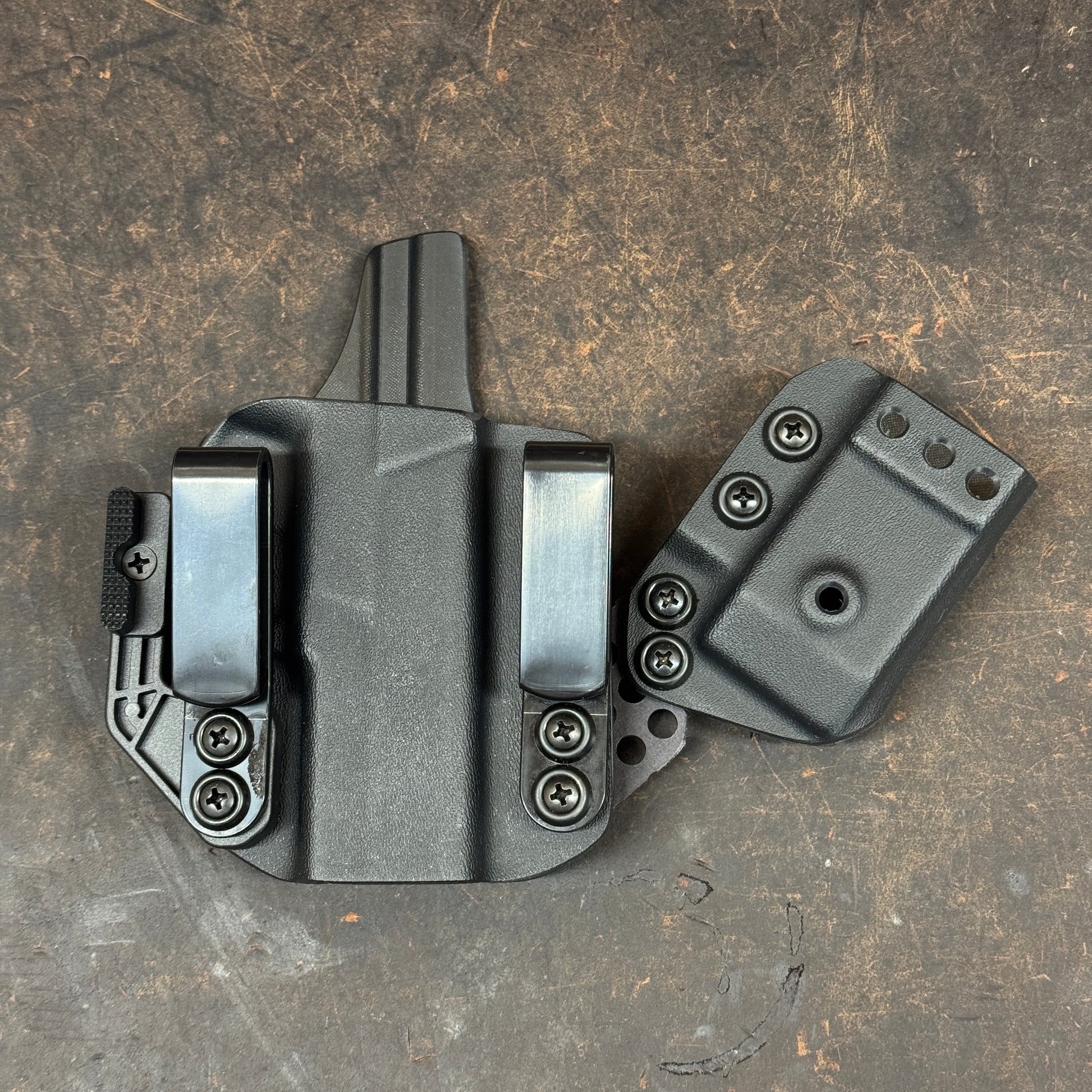 Appendix concealed carry holster that also has a removeable sidecar style attachment.